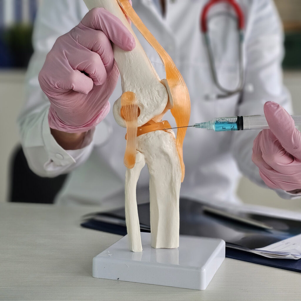 doctor with help from a syringe injects the patient blood plasma concept